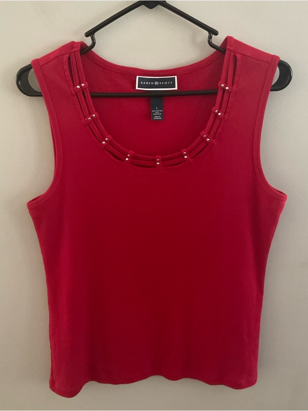 Karen Scott red sleeveless tank with scoop neck and beaded decorative detailing.
